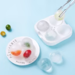 Forma Sfere de Gheata pentru Wiskey si Cocktail-uri Flippy, 4 Sfere, Material Plastic/Silicon Alimentar, Diametru 6.5 cm, cu Orificiu Tip Palnie pentru Umplere, 17 x 17 x 7 cm, Alb - imagine 3