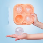 Forma Sfere de Gheata pentru Wiskey si Cocktail-uri Flippy, 4 Sfere, Material Plastic/Silicon Alimentar, Diametru 6.5 cm, cu Orificiu Tip Palnie pentru Umplere, 17 x 17 x 7 cm, Portocaliu - imagine 3